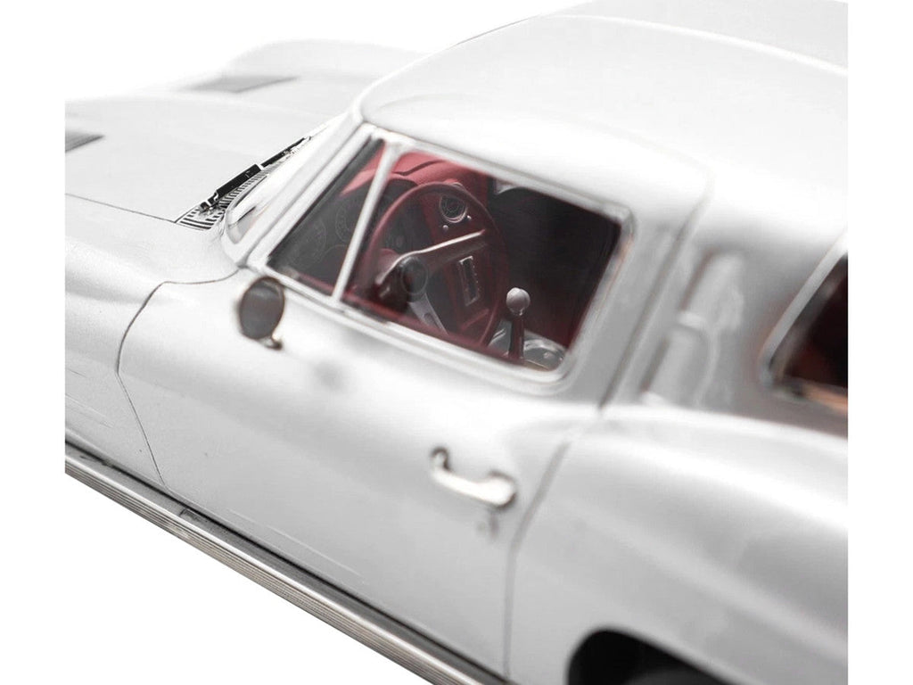 1963 Chevrolet Corvette Sting Ray Sebring Silver Metallic with Red Interior 1/18 Diecast Model Car by Norev