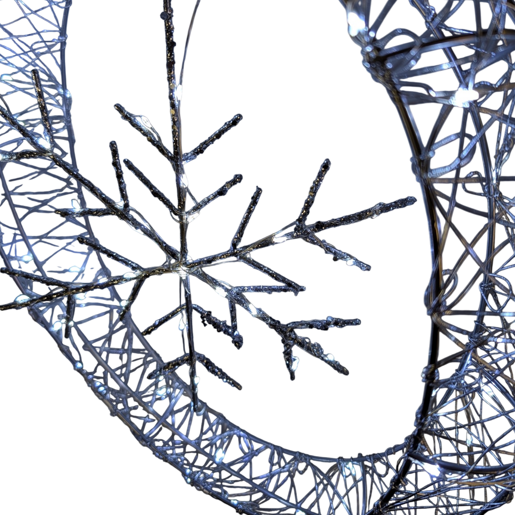 Frosted Elegance: A Silver Snowflake Ornament Aglow - 20 inch