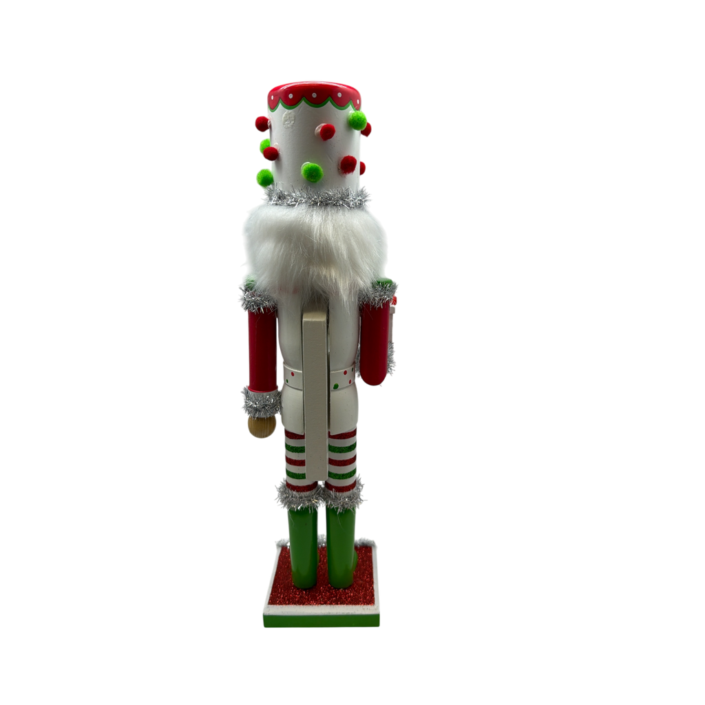 Red White and Green Nutcracker With Polka Dot Pom Pom Hat